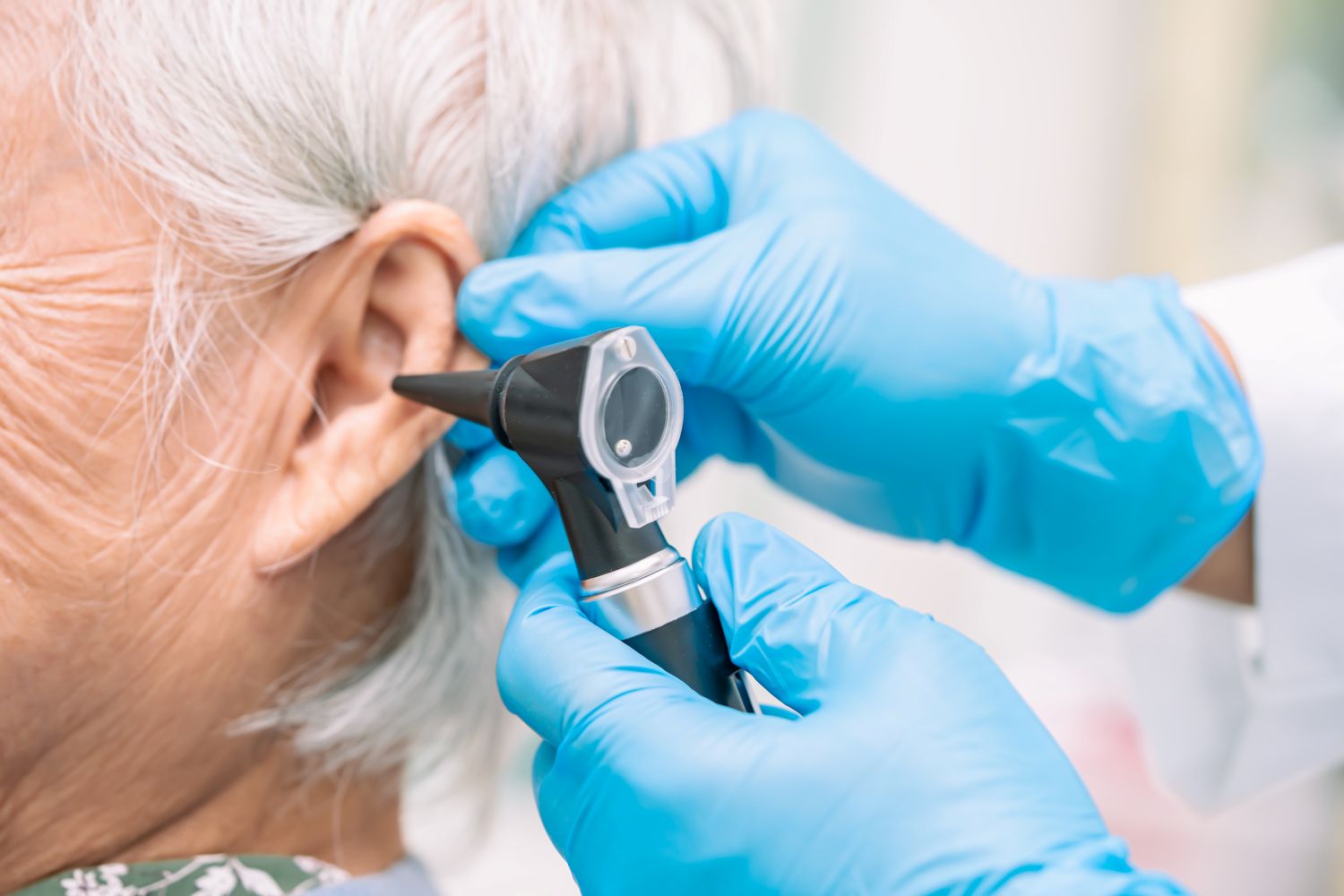 elderly woman getting hearing checked